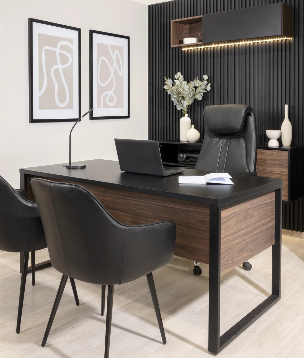 Modern conference room with long wooden table, ergonomic chairs, glass partitions, and professional lighting.